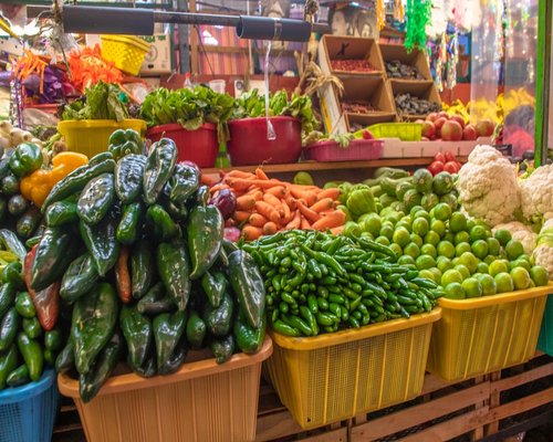 Traditional Mexican market showing fresh vegetables and nopales